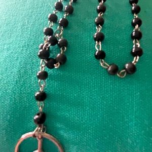 Beaded necklace with Peace sign pendant.
